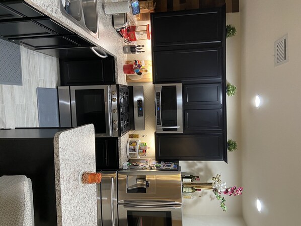 Microwave, dishwasher, coffee/tea maker, cookware/dishes/utensils
