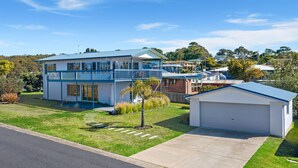 A two-story house with a balcony, a garage, and a well-maintained lawn. - 27 Harrison Street, Dalmeny (Dalmeny)