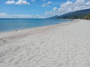 On the beach, white sand