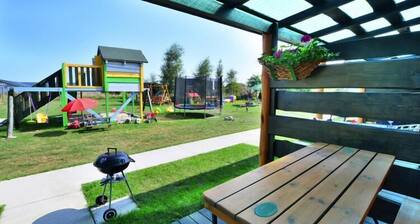 Comfortable holiday homes, garden, playground