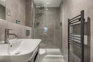 Bathtub, hair dryer, towels