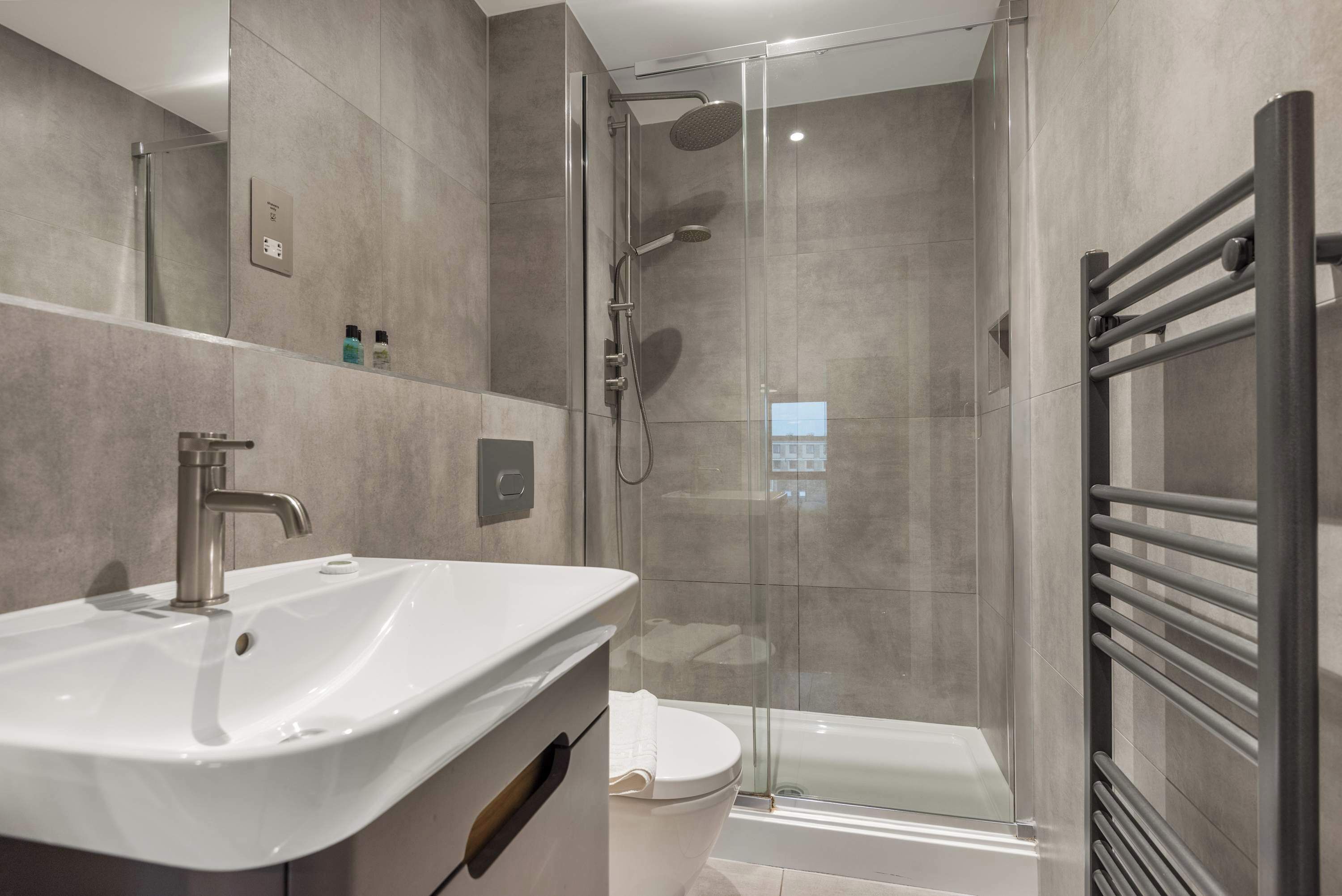 Bathtub, hair dryer, towels