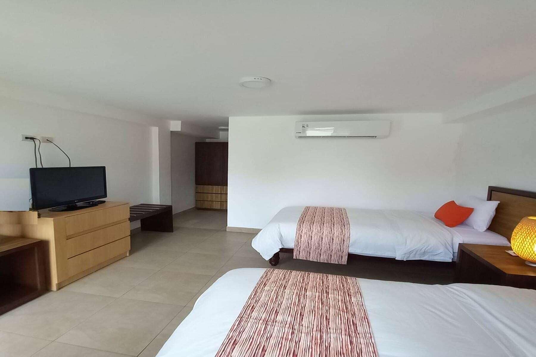 Luxe beddengoed, donzen dekbedden, pillowtop-bedden, een minibar