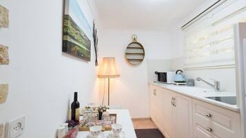 Fridge, microwave, toaster, cookware/dishes/utensils