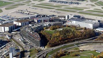 An airport with multiple runways, terminal buildings, and surrounding infrastructure.