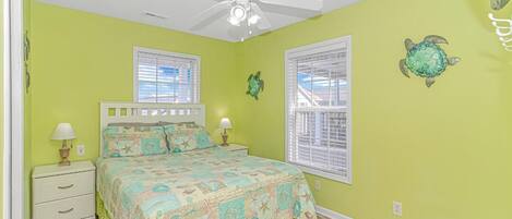 Another view of queen bed in yellow room