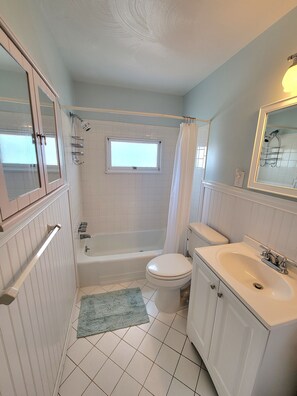 Combined shower/bathtub, soap, toilet paper