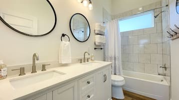 Combined shower/bathtub, hair dryer, towels, soap