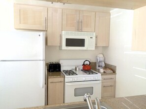 Fridge, microwave, stovetop, coffee/tea maker