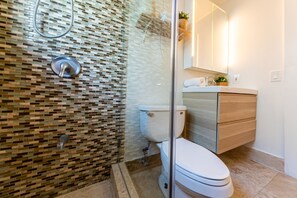 Combined shower/tub, hair dryer, towels, soap