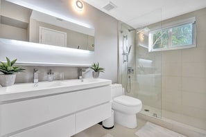 Combined shower/tub, hair dryer, towels, soap