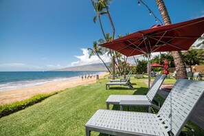On the beach, sun loungers, beach towels