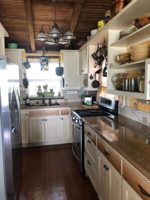 Fridge, microwave, oven, stovetop - Artist’s unique, eclectic waterfront  home featured in Coast magazine. (San Leon)