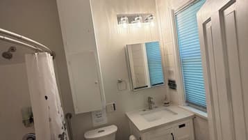 Combined shower/tub, hair dryer, towels, soap