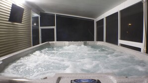 A hot tub with a control panel, surrounded by windows and a ceiling with a light fixture. - 🔆🏝LITTLE PARADISE🏝🔆 (Saint James City)