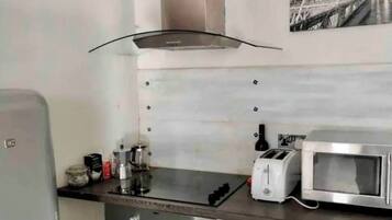 Microwave, oven, coffee/tea maker, cookware/dishes/utensils