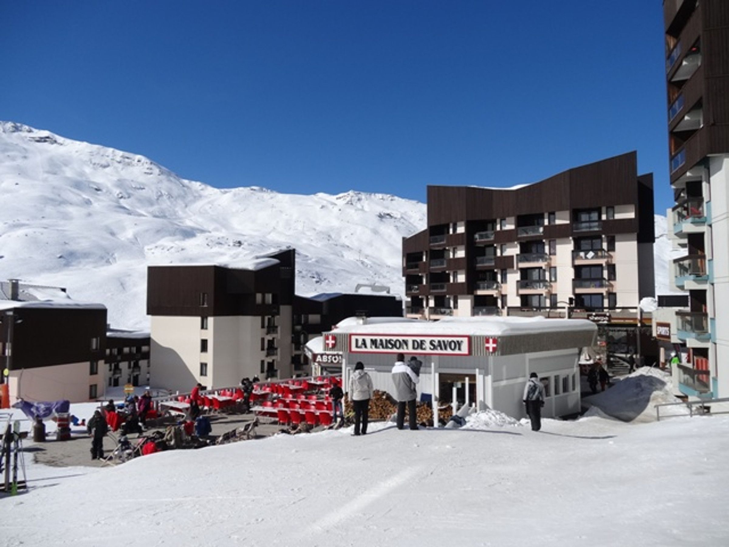 A snow-covered mountain with a building labeled "LA MAISON DE SAVOY" in the foreground.