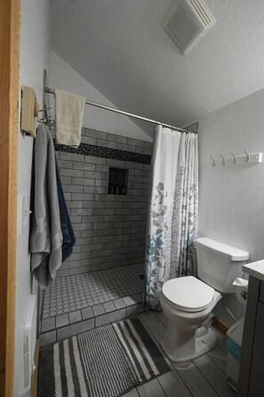 Shower, hair dryer, towels, soap
