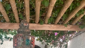 A rustic wooden pergola with a decorative hanging light fixture. - WINTER LONG STAY.  OASIS IN CABO DE GATA (El Pozo de los Frailes)