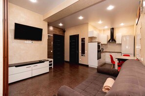 Apartment | Wohnbereich | 32-Zoll-LCD-Fernseher mit Kabelempfang, Fernseher, aktuelle Filme