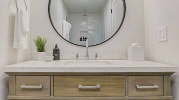 Shower, eco-friendly toiletries, hair dryer, towels