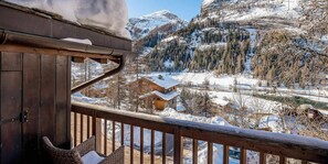 Relax on the balcony with a wicker chair and take in the serene mountain views.