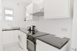 Economy Apartment, 1 Bedroom, Private Bathroom, Courtyard View | Private kitchen | Full-size fridge, microwave, oven, stovetop