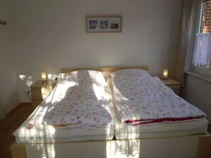 1 bedroom, bed sheets - Haus Amrum - Located east village on the dunes: FeWo1 * look, book, experience * (Juist)