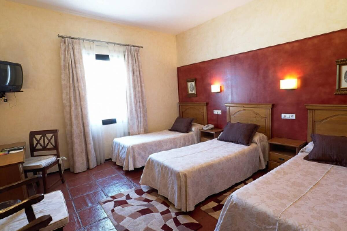 Standard Triple Room | Minibar, in-room safe, desk, laptop workspace