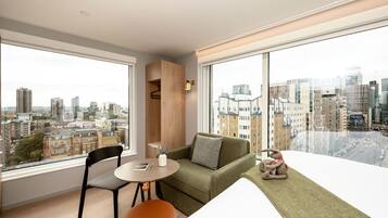 Hypo-allergenic bedding, laptop workspace, blackout curtains