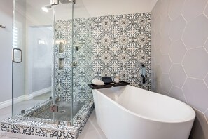 Combined shower/bathtub, towels, toilet paper