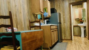 Coffee/tea maker, fridge, microwave, cookware/dishes/utensils