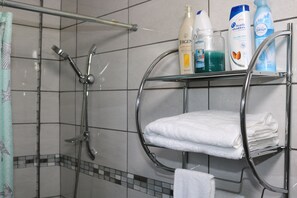 Shower, hair dryer, towels, soap