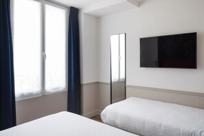 Standard Triple Room | In-room safe, desk, laptop workspace, blackout drapes