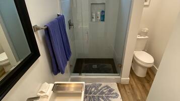 Shower, hair dryer, towels, soap
