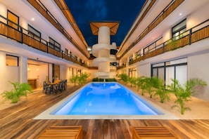 Outdoor pool, open 8:00 AM to 10:00 PM, pool loungers