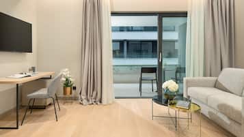 Family Suite | Living room | 60-inch Smart TV with satellite channels, TV