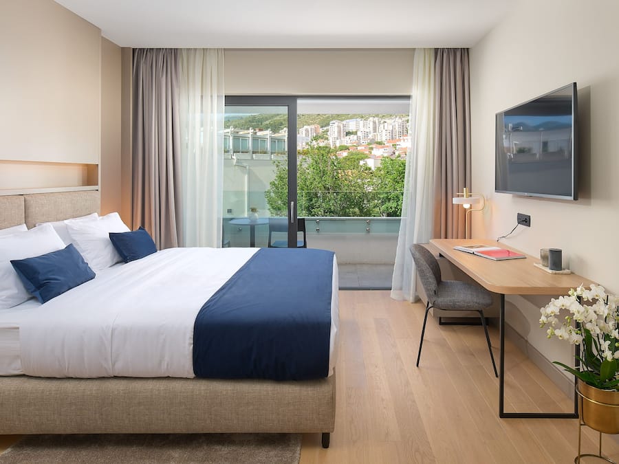 Superior Double Room | Minibar, in-room safe, desk, laptop workspace