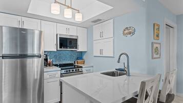 Coffee/tea maker, fridge, microwave, oven
