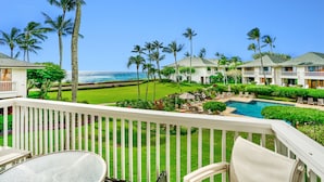 A resort with a pool, palm trees, and ocean views. - POIPU KAPILI 46 - FABULOUS OCEAN VIEWS - WHOLE UNIT AC - WALK TO BEACH/ SHOPPING (Koloa)