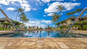 A pool area with a 'No Diving' sign, palm trees, and lounge chairs. - POIPU KAPILI 46 - FABULOUS OCEAN VIEWS - WHOLE UNIT AC - WALK TO BEACH/ SHOPPING (Koloa)