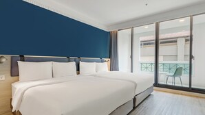 A hotel room with a large bed, a view of the outside balcony, and a modern design. - CHECK inn Select Taipei Nangang (Taipei)
