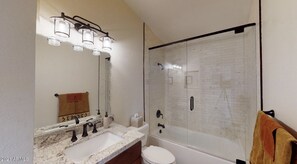 Combined shower/tub, hair dryer, towels, soap