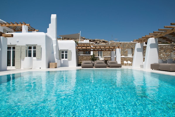An infinity pool, sun loungers