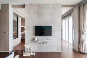 Deluxe Apartment | Living room | 50-cm flat-screen TV with cable channels, TV - Movenpick Residence Beach Access 2BR (Sattahip)