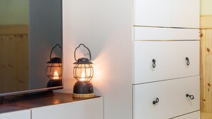 A white dresser with black handles and a mirror above it. - Taean Jiyu Ne Pension (Taean)