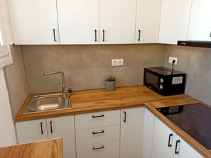 Deluxe Apartment, Sea View | Private kitchen | Full-sized fridge, microwave, stovetop, espresso maker