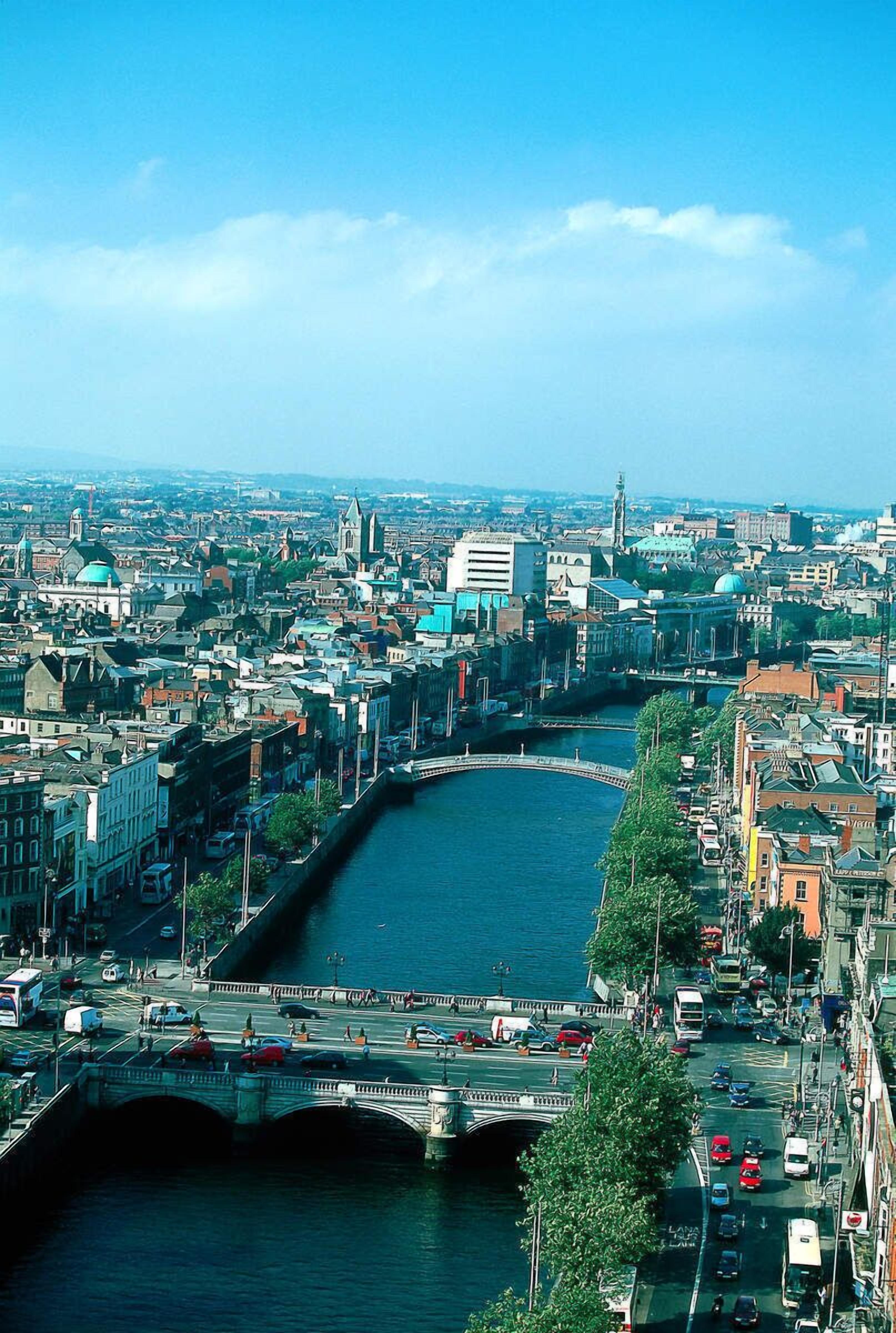 A cityscape with a river, bridges, and buildings.