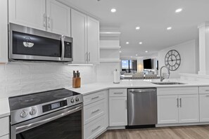 Coffee/tea maker, fridge, microwave, oven