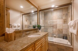 Bathtub, hair dryer, towels, soap